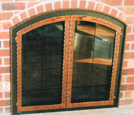 Hyport Meadow Black frame, with antique copper half inch hammer & groove molding, scrolled steel vice bi fold doors, standard smoke glass.  Comes with gate mesh spark screens.